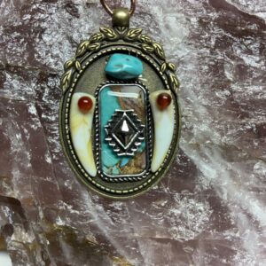 Southwestern Brass Pendant with Wolf Tooth Accents